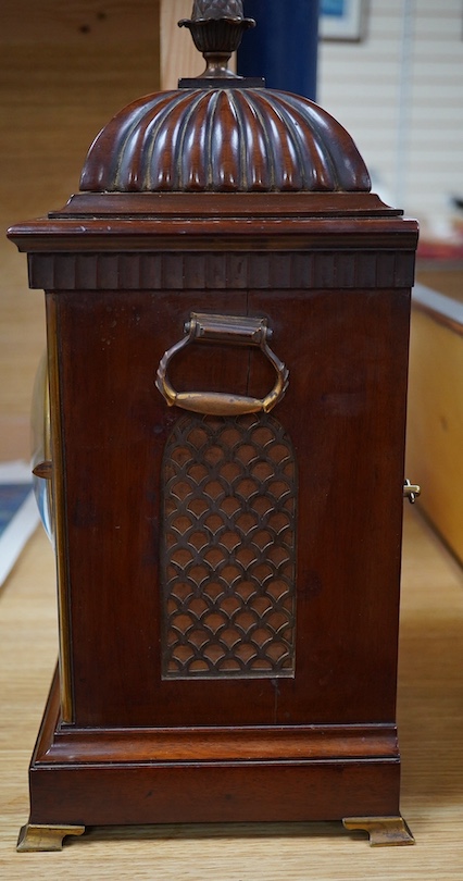 An early 20th century mantel clock, the dial inscribed J W Benson Ltd, London, with pendulum and key, 41cm high. Condition - fair, untested